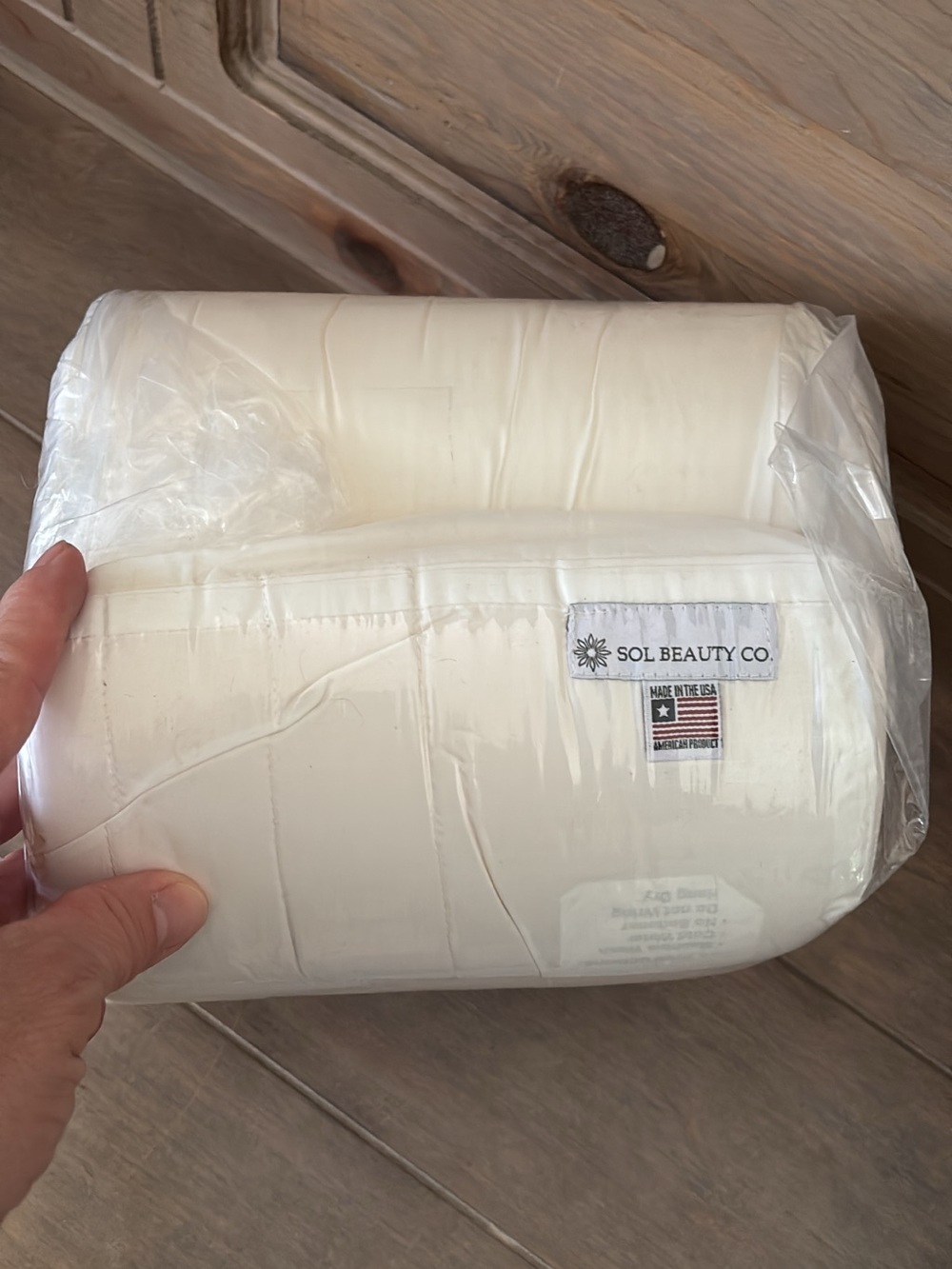 Sol Beauty Co. White Neck Roll Pillow for doing lashes.